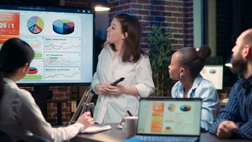 Diverse businesswomen in business meeting, employee presenting analytics research